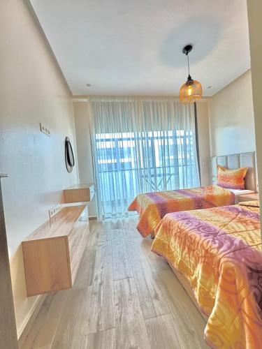 Ένα ή περισσότερα κρεβάτια σε δωμάτιο στο agadir bay founty