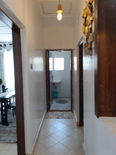 a hallway leading to a bathroom with a sink at Greenstar villa homes in Kisii