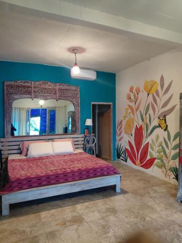 En eller flere senge i et værelse på Ameli Bed & Breakfast