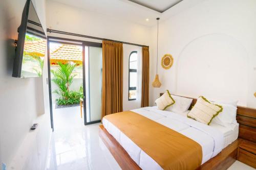 Postel nebo postele na pokoji v ubytování Sundari Guesthouse Pererenan