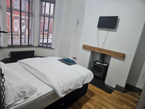 En eller flere senge i et værelse på Comfort and Leisure