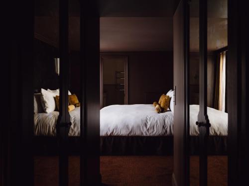 Postel nebo postele na pokoji v ubytování L'Opale Noire