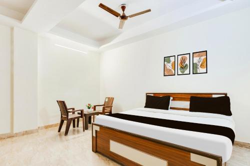 Ένα ή περισσότερα κρεβάτια σε δωμάτιο στο HOTEL O RAJ STAY