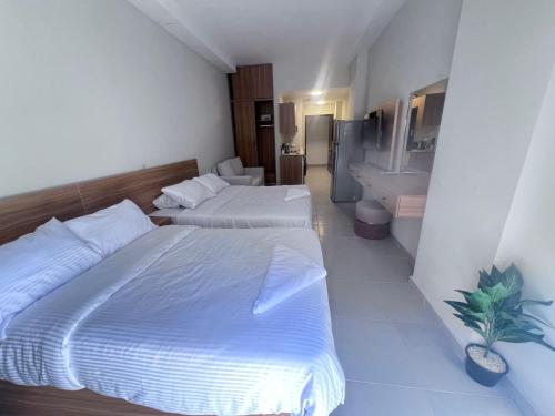 En eller flere senge i et værelse på Florenza Khamsin Resort