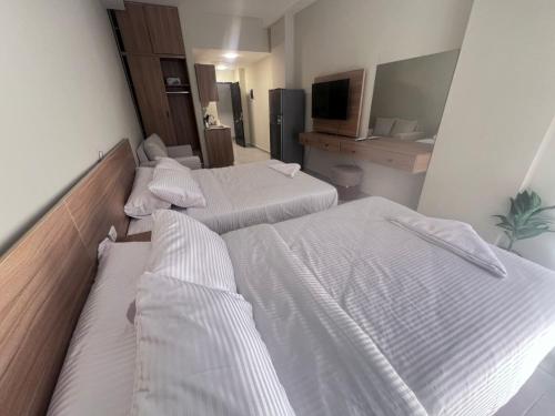En eller flere senge i et værelse på Florenza Khamsin Resort