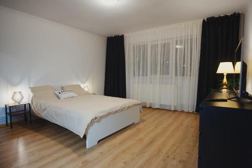 En eller flere senge i et værelse på Big Apartment