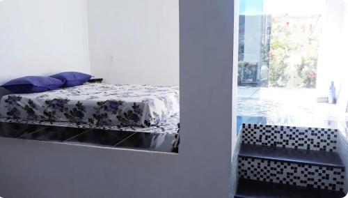 a bedroom with a bed with a mirror and a window at Um castelo só pra você! 