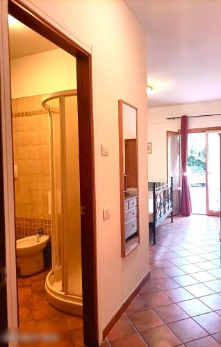 a bathroom with a sink and a mirror in a room at Villa Etruria Guest House in Pitigliano