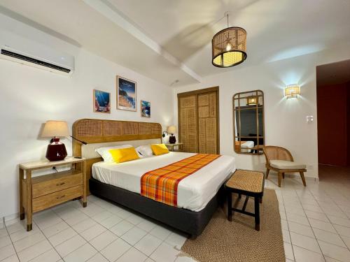 Postel nebo postele na pokoji v ubytování Résidence Le Vallon Guadeloupe Parc Piscine Appartements & Studios