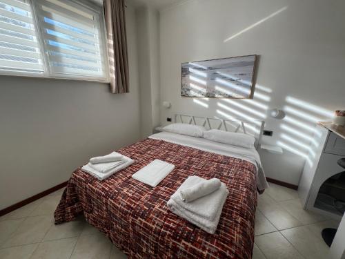 Postel nebo postele na pokoji v ubytování Alloggio Turistico - I tre Moschettieri - Zona Universitaria e Tribunale Nuovo