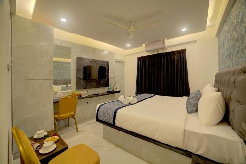 Ένα ή περισσότερα κρεβάτια σε δωμάτιο στο Hotel AeroStay Bangalore Airport