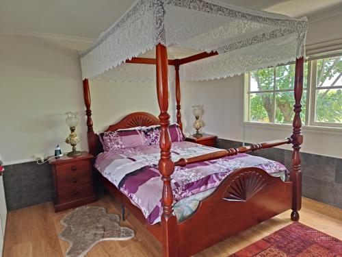 Giường trong phòng chung tại Grandvista Cottage