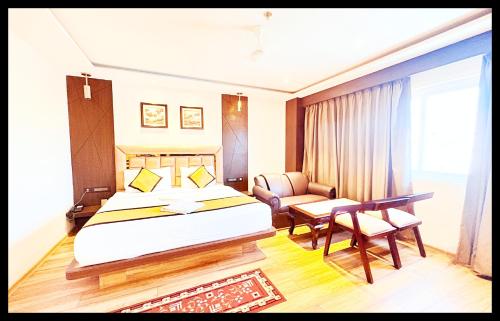 En eller flere senge i et værelse på The In Dra