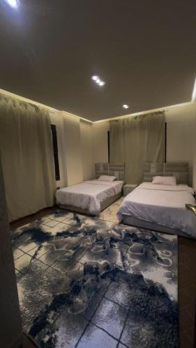 En eller flere senge i et værelse på الشيخ زايد شارع عمار ابن ياسر