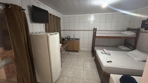 Et badeværelse på Recanto Pousada JU&JU com piscina COMPARTILHADA