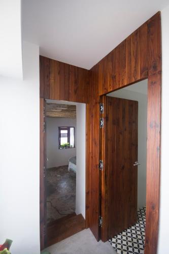 an open door into a room with a bedroom at Suite Risco 2 in La Guancha