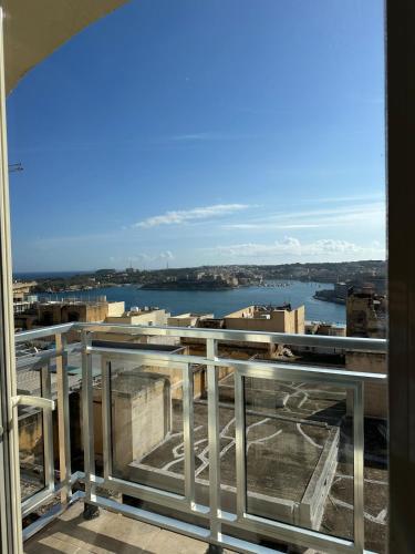 a view of the water from a balcony at Valletta Minimal, Breezy, Coastal chic City Life in Valletta
