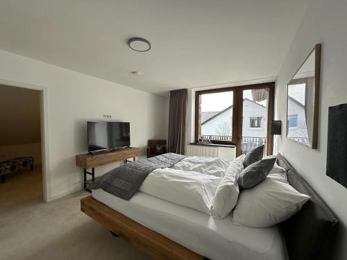 En eller flere senge i et værelse på Zum Wilzenberg