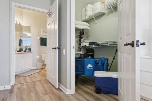 a hospital room with a bed and a bathroom at 3BR Windsor Hills Condo Water Park and Skeeball Near Disney No Resort Fees in Orlando