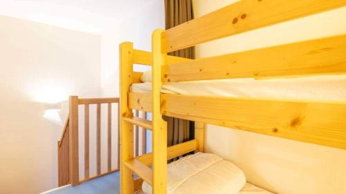 a couple of bunk beds in a room at Les Balcons d Aix N701 2P6 in Les Déserts