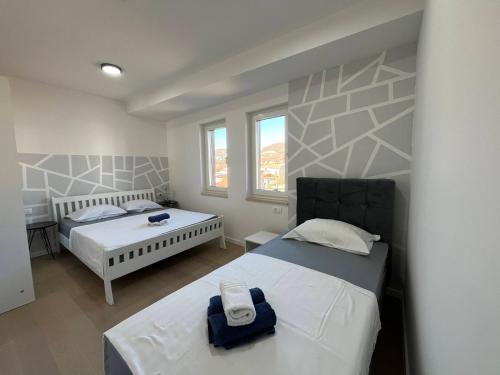 Ένα ή περισσότερα κρεβάτια σε δωμάτιο στο Apartman Ivana