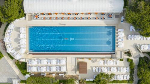an overhead view of a resort with a swimming pool at Grand-Hôtel du Cap-Ferrat, A Four Seasons Hotel in Saint-Jean-Cap-Ferrat