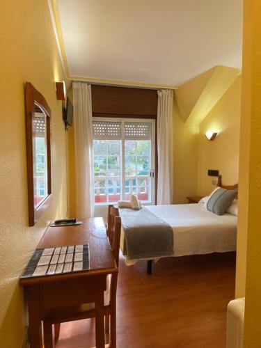 Postel nebo postele na pokoji v ubytování Hotel Restaurante Isape GBC