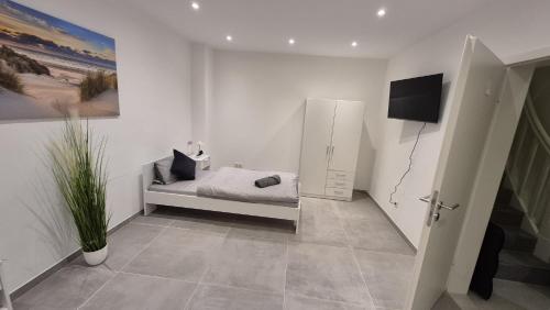 Et tv og/eller underholdning på Gästehaus Hagen 6 Betten, Parkplatz, Küche, WLAN Easybooking24