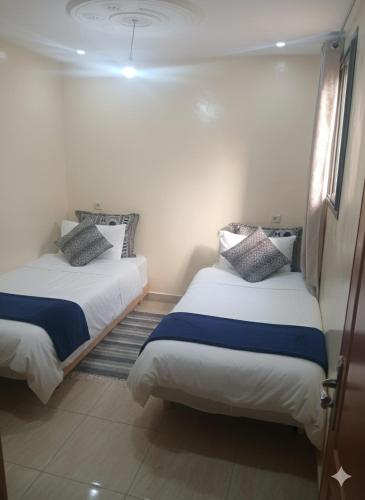 En eller flere senge i et værelse på lina appartement