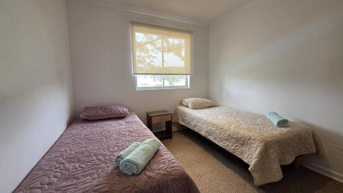 En eller flere senge i et værelse på Oceana Suites El Tabo