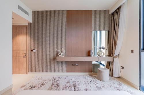 a bathroom with a sink and a mirror at Nasma Luxury stays- Sophisticated Interior near Hayat Beach in Ras al Khaimah