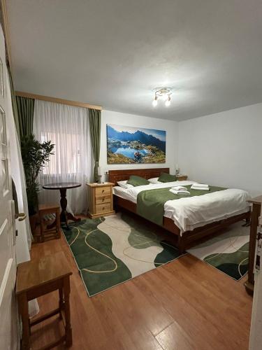 a bedroom with a bed and a table in it at Belvedere La Cristina in Corbeni