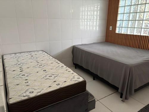 Een bed of bedden in een kamer bij Casa Cacau