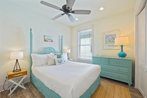 a bedroom with a blue bed and a ceiling fan at Arrabella - Gulf Views with Deck & Community Pool in Santa Rosa Beach