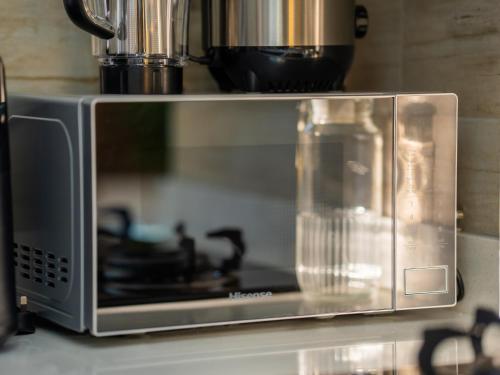 Kuchyň nebo kuchyňský kout v ubytování Ivys Cozy Homes Kampala B6