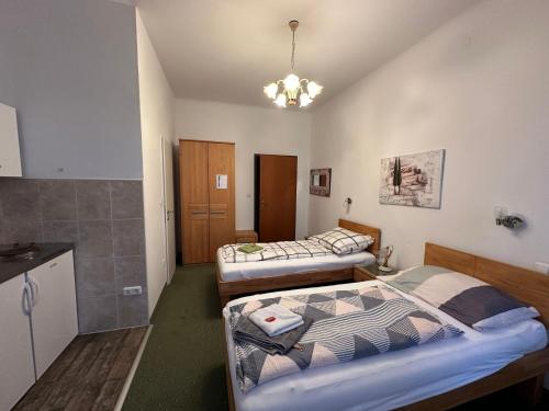 Postel nebo postele na pokoji v ubytování Aparthotel Mariazellerhof