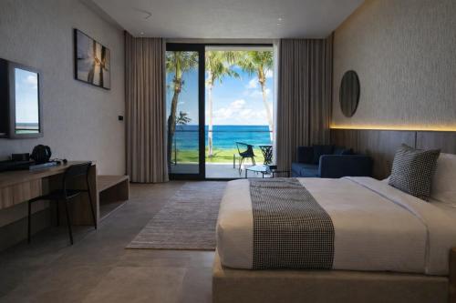 En eller flere senge i et værelse på Dhabab Bay Resort