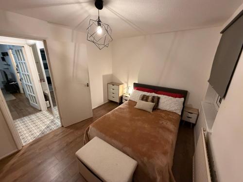 a bedroom with a large bed in a room at HRF Hackney Apartments in London