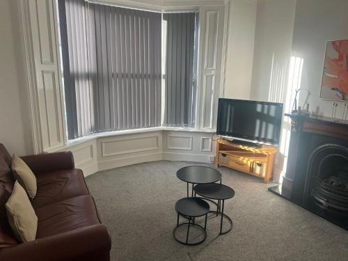 Et tv og/eller underholdning på Cosy 4 bed House