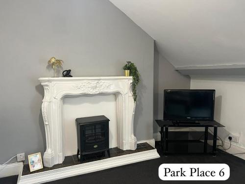 TV a/nebo společenská místnost v ubytování Park Place Apartments