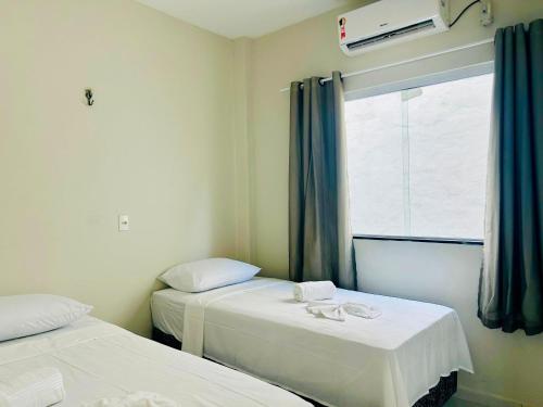 En eller flere senge i et værelse på Serena Jeri Flats