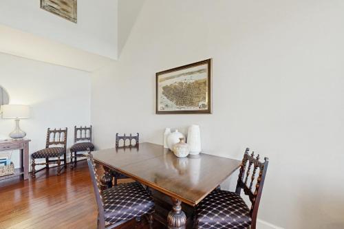 a dining room with a wooden table and chairs at 195 East Bay in Charleston