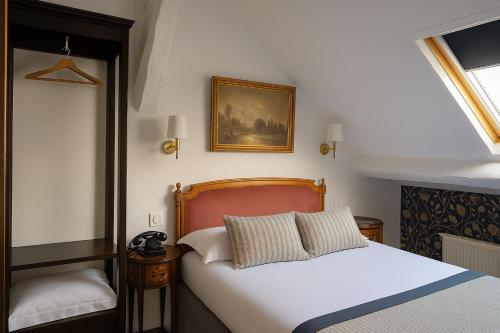 Voodi või voodid majutusasutuse Hotel Dandy Rouen centre toas