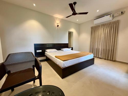 Ένα ή περισσότερα κρεβάτια σε δωμάτιο στο Malpe Serene Stays