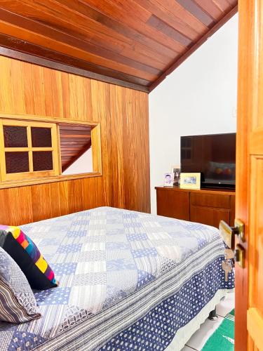 a bedroom with a bed on a boat at Angra Sea House in Angra dos Reis