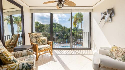 a living room with a view of the ocean at Tranquility at MoonBay B - 304 in Key Largo