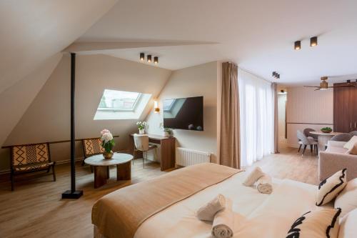 En eller flere senge i et værelse på Kab Hotel - Saint Mandé