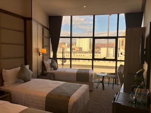 En eller flere senge i et værelse på غرف بالقرب من الحرمHotel Near Masjid nabawi