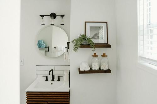 a bathroom with a sink and a mirror at Beachside Bliss - Beach House Unit 2 in Jacksonville Beach