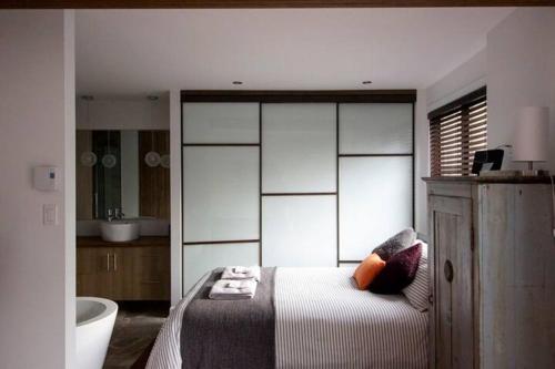 En eller flere senge i et værelse på Chouette loft urbain avec foyer